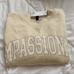 H&M compassionate sweatshirt